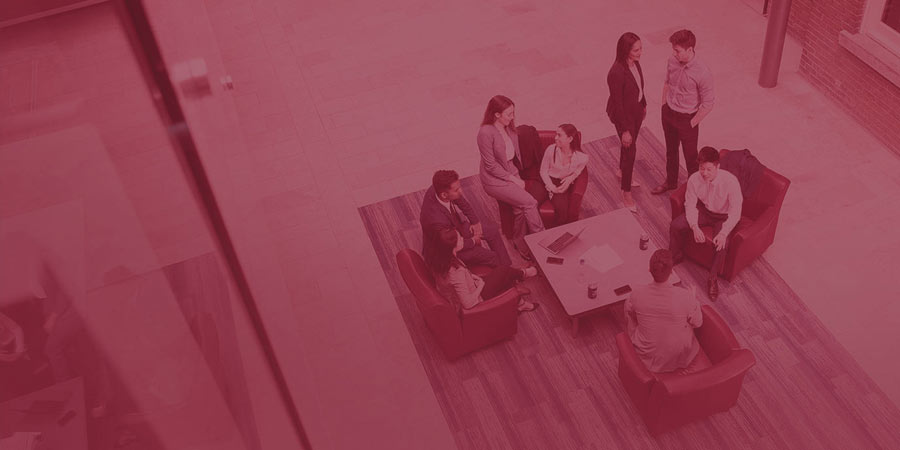 students sitting together in attrium
